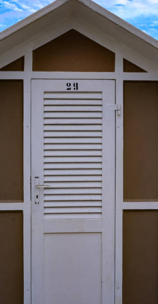 istock number 29 bathhouse cabin. brown and white 1340005961
