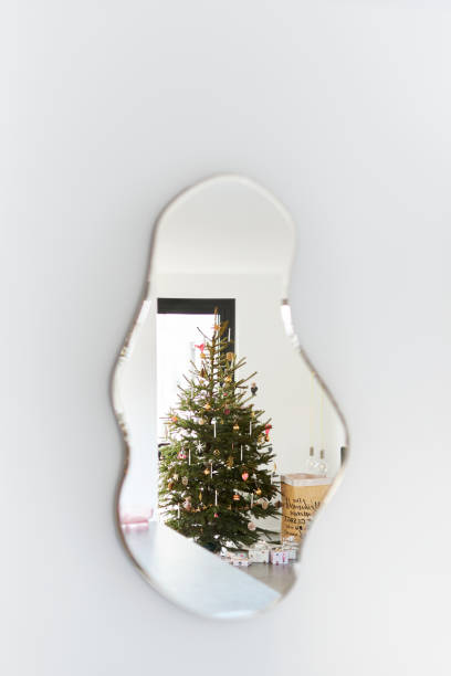 istock A modern decorated Christmas tree under which wrapped Christmas presents 1340008785