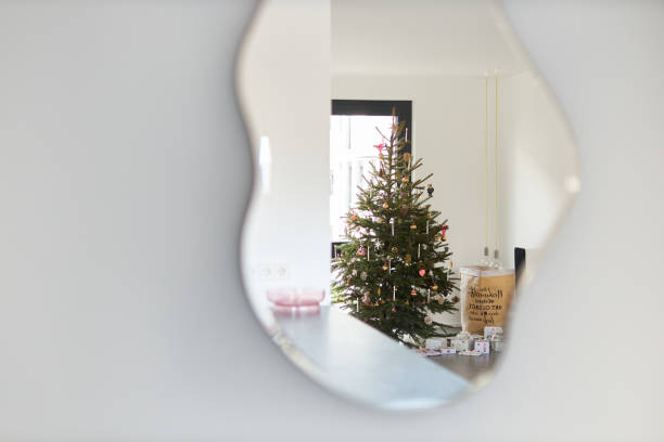 istock A modern decorated Christmas tree under which wrapped Christmas presents 1340008930