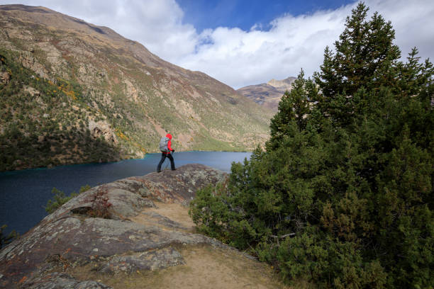 istock Backpacker hiking in high altitude winter mountains 1340010305