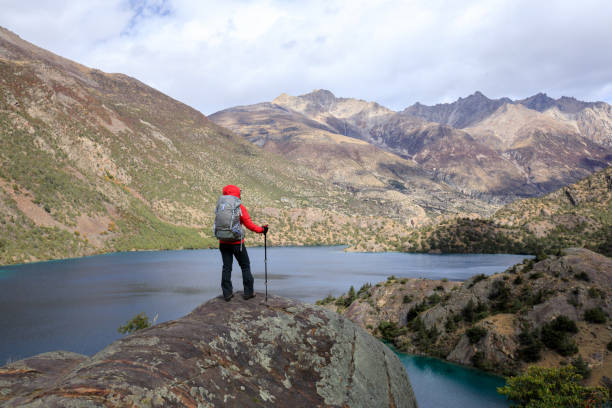 istock Backpacker hiking in high altitude winter mountains 1340010331