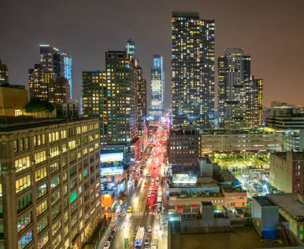 Aerial view of streets and skyscrapers of Midtown at night - New York City. Aerial view of streets and skyscrapers of Midtown at night - New York City new york city skyline new york state night stock pictures, royalty-free photos & images