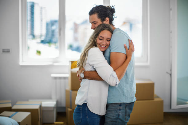 Couple moving into a new apartment. stock photo
