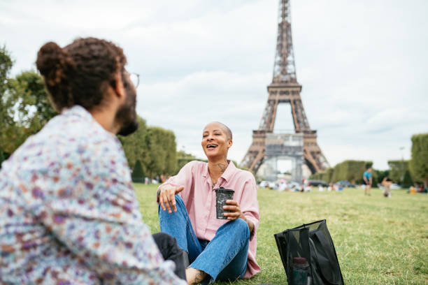 istock Falling in love in Paris, young couple near Eiffel tower smiling 1340012093