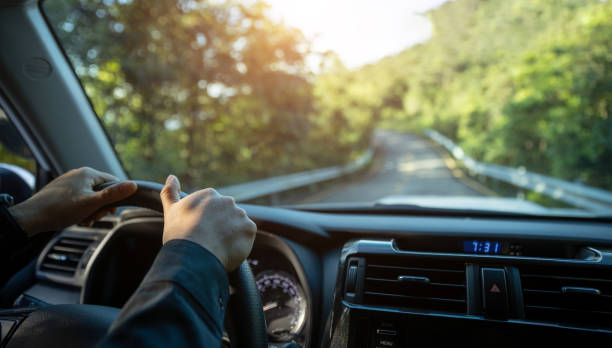istock people driving car on mountain road 1340012355