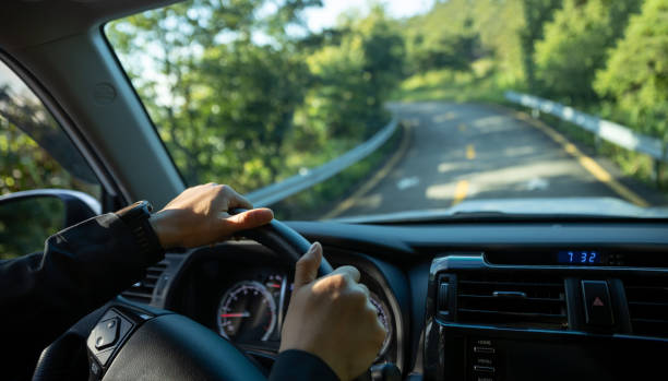 istock people driving car on mountain road 1340012401