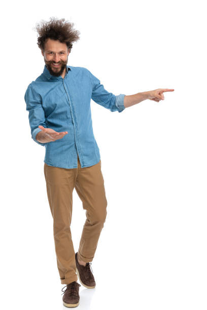 istock casual man greeting someone then pointing to the side 1340012447