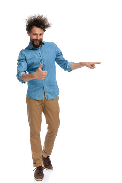 istock handsome businessman giving a like and pointing 1340013050