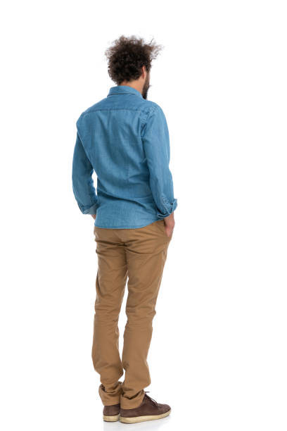 istock handsome casual man standing with his back at the camera 1340013234