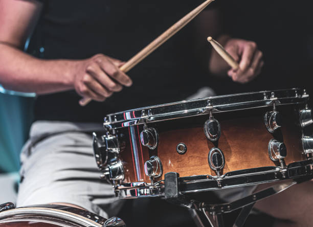 istock Close-up shot of a drummer playing a snare drum with sticks. 1340014061