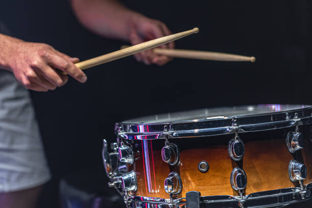 istock The drummer's hands hold drumsticks and play the snare drum. 1340014072