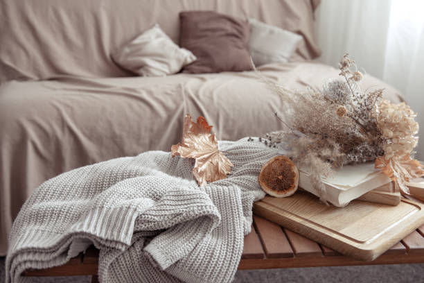 istock Fall vibe with fall decor details and a knitted sweater in the room. 1340014144