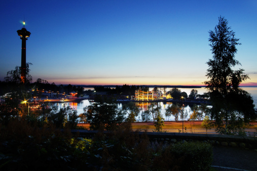 Night view in Tampere, Finland. On the left is Nasinneula observation tower, and in the middle Sarkanniemi amusement park with roller coaster. Lake Nasijarvi in the background.