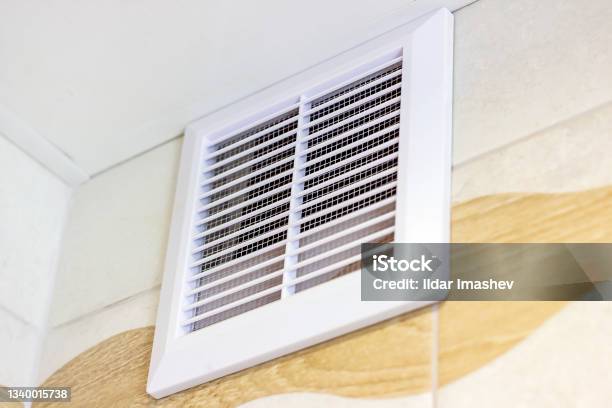 White Plastic Ventilation Panel In The Bathroom For Air Circulation Stock Photo - Download Image Now