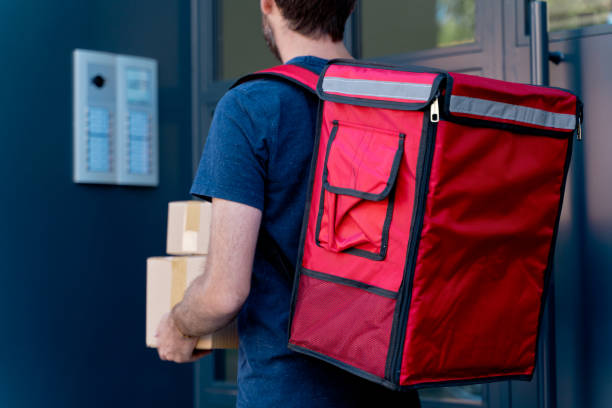 istock Close up of delivery man delivering parcel box. 1340015882