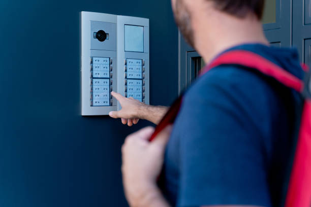 istock Close up of delivery man delivering parcel box. 1340015891