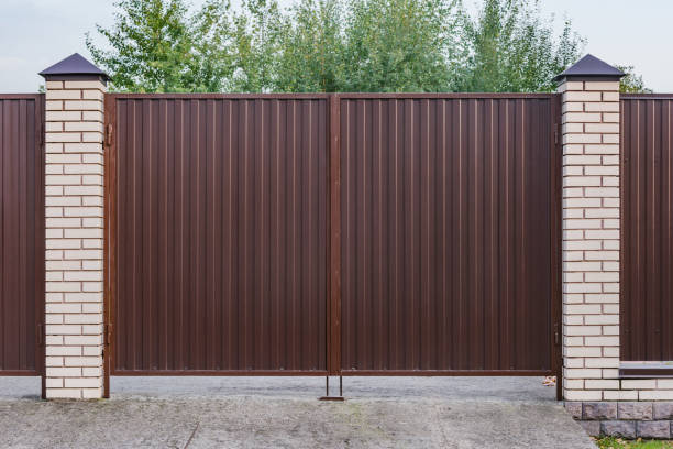 istock Metallic new gate by the house. 1340016638