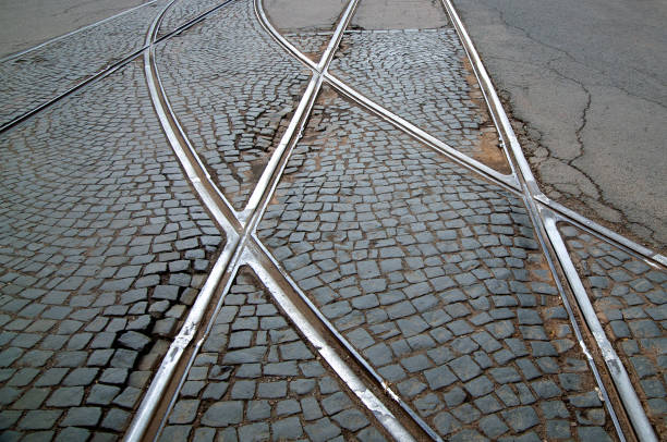 abstract background with tram rails on paving stones and asphalt. High quality photo