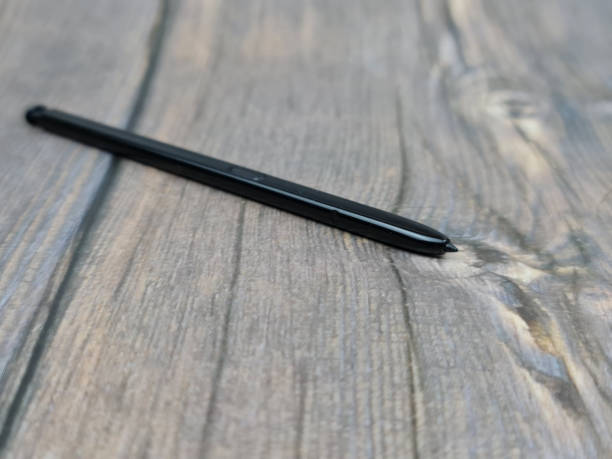 istock Black stylus from a mobile device. Digital stylus close-up. 1340018769
