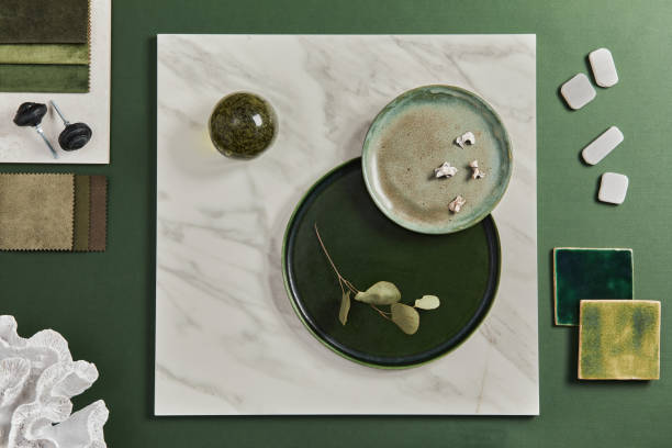 istock Stylish flat lay composition of creative architect moodboard design with samples of building, textile and natural materials and personal accessories. Top view, green background, template. 1340022354
