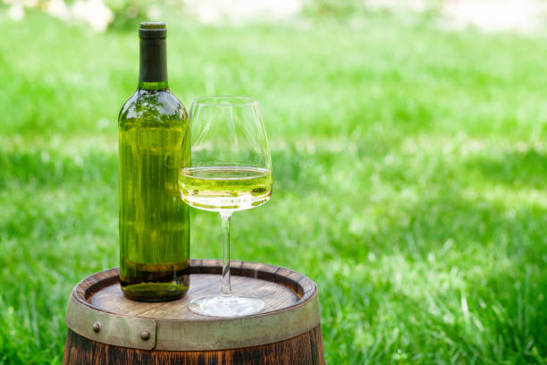 istock Wine bottle and glass with white wine 1340027506