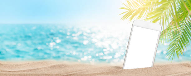 istock Smartphone on tropical sea beach 1340029101