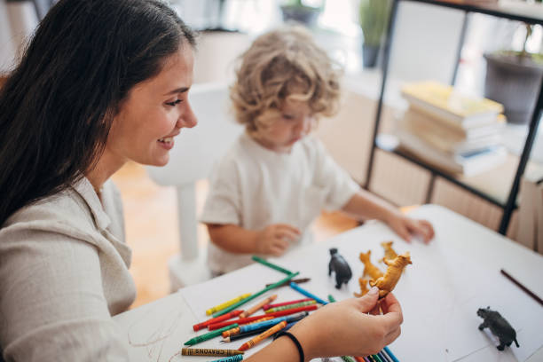 istock Mom and little son playing together 1340029864