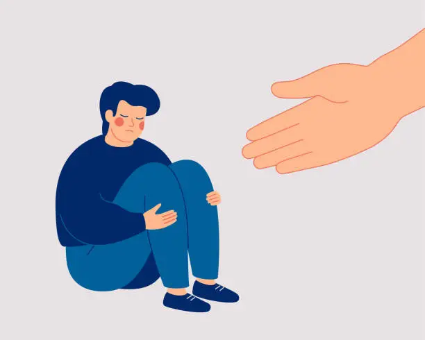 Vector illustration of A human hand helps a sad young man to get rid of anxiety. The counselor supports the boy with psychological problems.