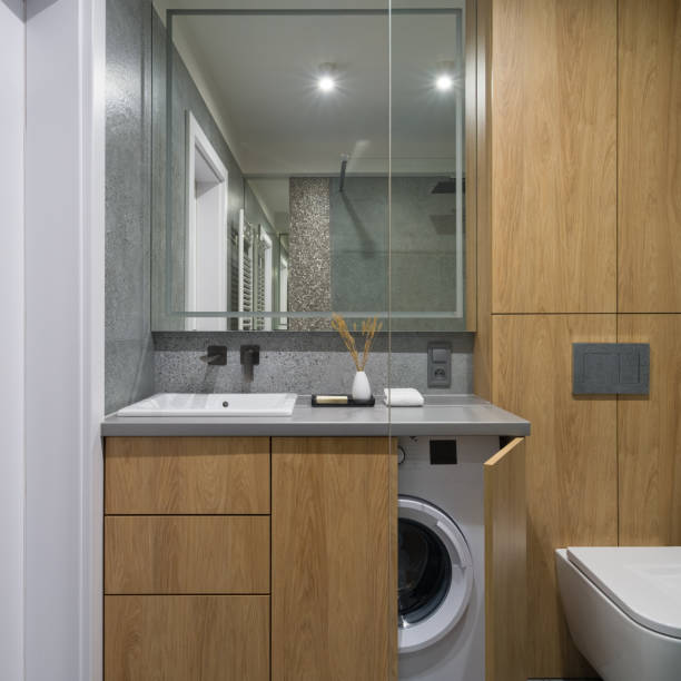istock Modern bathroom with washing machine in cabinet 1340030209