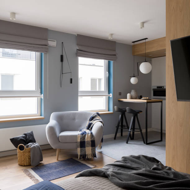 istock Modern studio apartment with cozy armchair 1340030225