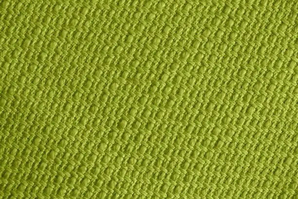 Photo of Olive Green Linen Khaki Texture Woven Cotton Rope Straw Pattern Mesh Grid Background Macro Photography