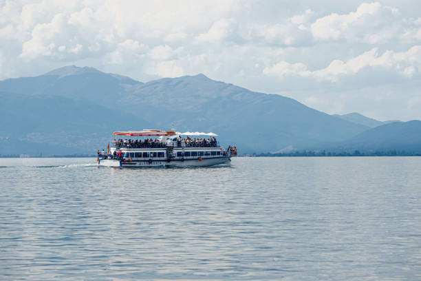 Boat in the middle of Lake Como. Point of view: Bellagio