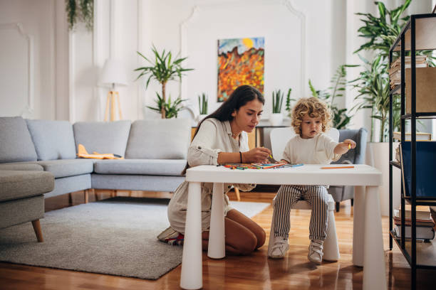 istock Mother and son coloring together and having fun 1340034892