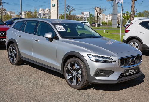 Kyiv, Ukraine - May 10, 2021: New V60 Cross Country hatchback car outdoors on display in Volvo Winner Center dealership company. The Volvo Group is a Swedish multinational manufacturing company.