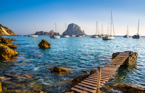 Ibiza cala d Hort with Es Vedra islet sunset Ibiza cala d Hort with Es Vedra islet sunset in Sant Josep of Balearic Islands ibiza town stock pictures, royalty-free photos & images