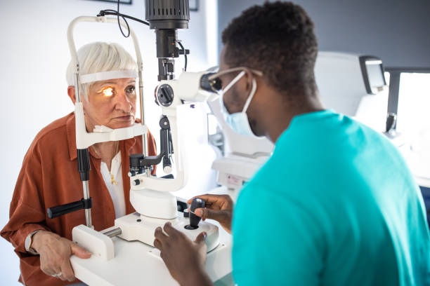 istock Senior woman undergoing intraocular pressure exam at optometrist office 1340039936
