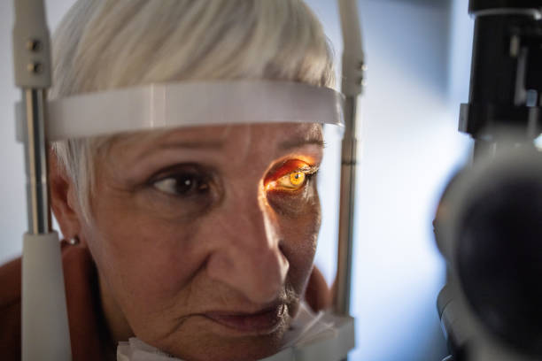 istock Senior woman undergoing eye exam at ophthalmologist office 1340039979