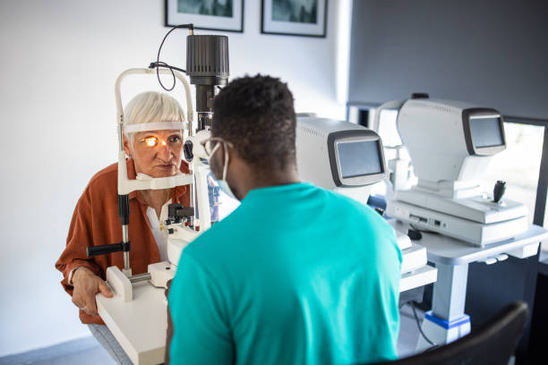 Senior woman undergoing intraocular pressure exam at optometrist office