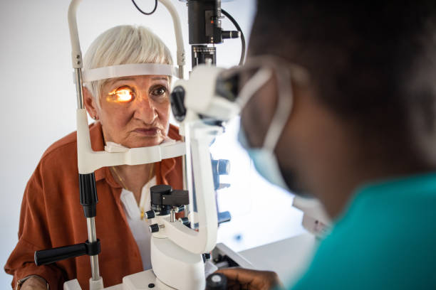 istock Senior woman undergoing intraocular pressure exam at optometrist office 1340042923