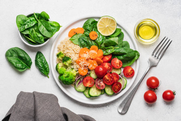 istock Salad with quinoa, spinach, broccoli, tomatoes, cucumbers and carrots 1340043057