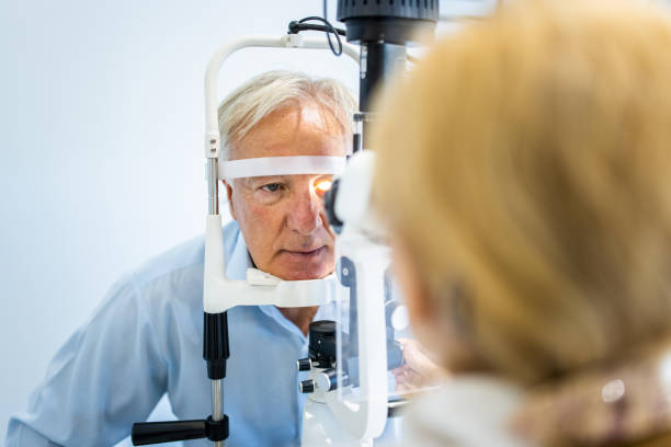 istock Senior man undergoing intraocular pressure exam at optometrist office 1340043174