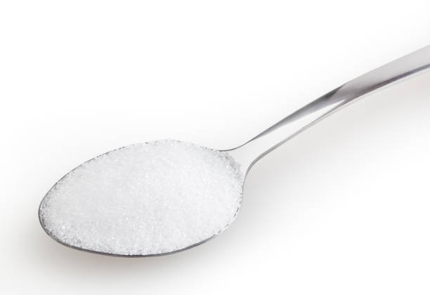 istock Spoon of salt isolated on white background with clipping path 1340043647