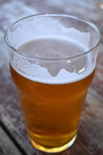 istock Close-up of beer glass with foam 1340044122
