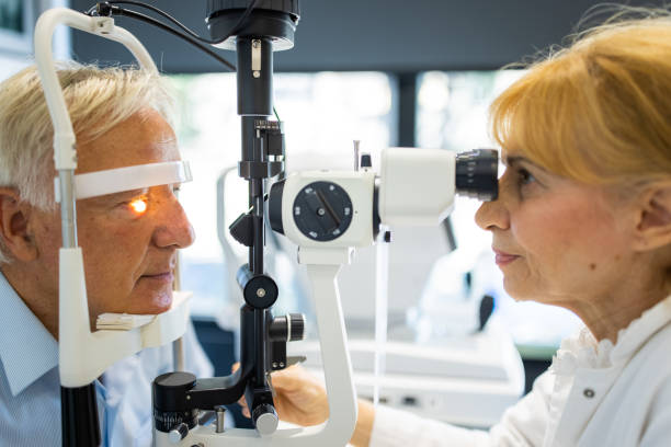 istock Senior man undergoing intraocular pressure exam at optometrist office 1340044191