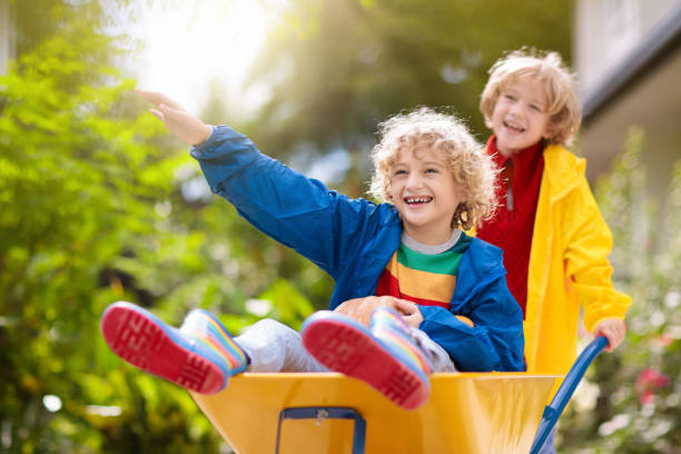 istock Kids on pumpkin patch. Child autumn outdoor fun. 1340045019
