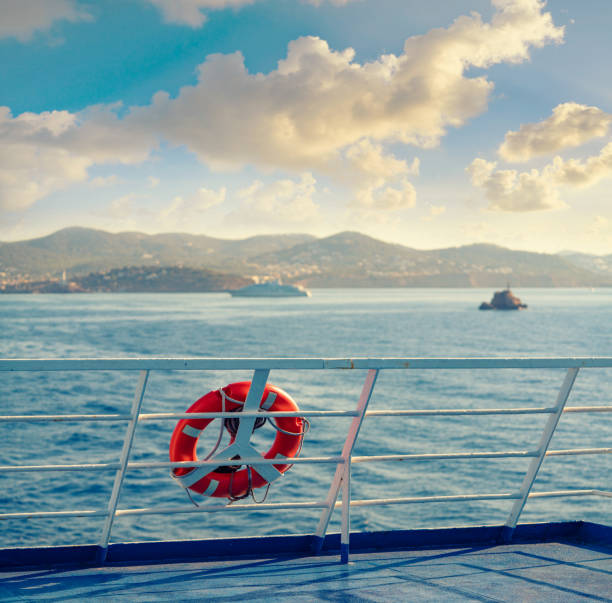Ferry railing in Ibiza with round buoy at Mediterranean Balearics sea of Spain