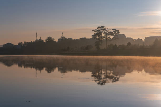 Early foggy morning on Xuan Huong lake, Da Lat city, Lam Dong province.