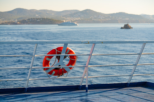 Ferry railing in Ibiza with round buoy at Mediterranean Balearics sea of Spain