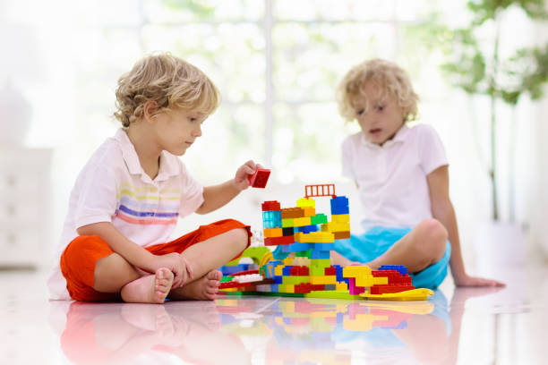 istock Child playing with toy blocks. Kids play. 1340045913