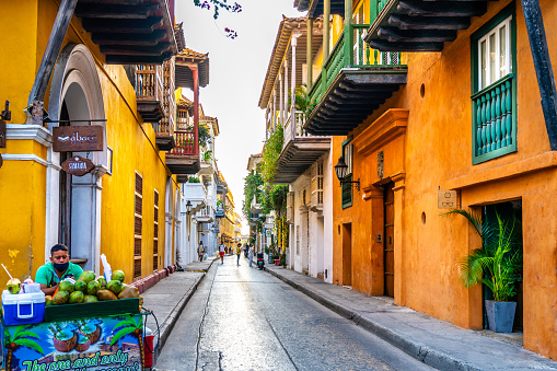 Cartagena, Colombia - May 19, 2021: Historical Centre of Cartagena Colombia - this area is known for its colourful buildings and Spanish Colonial architecture. People can be seen on the street.